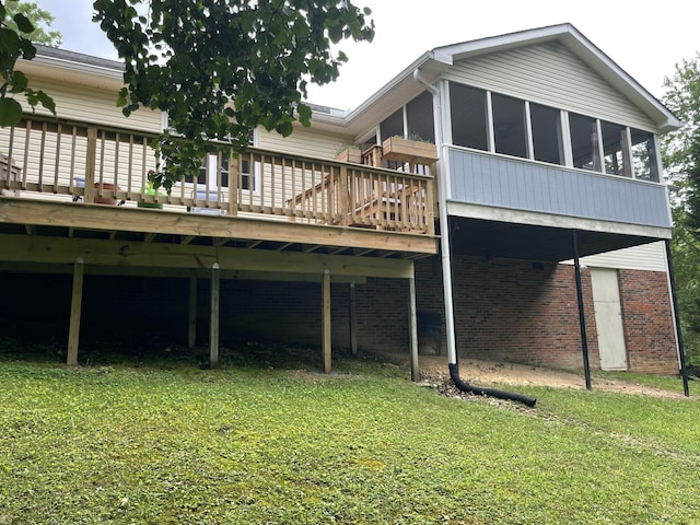 610 Hickory Ridge Trl, Ringgold, GA 30736 - rear view of house featuring a deck, a yard, a sunroom, and brick siding