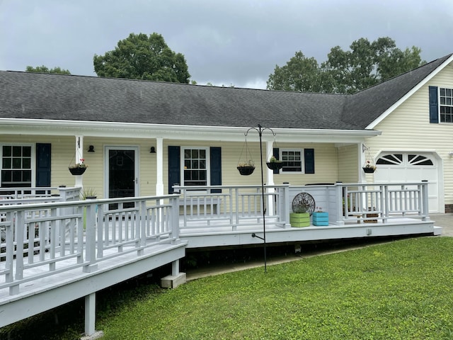 610 Hickory Ridge Trl, Ringgold, GA 30736 - back of house with a porch, a lawn, and a shingled roof