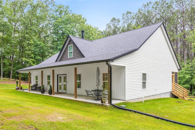 8331 Troubadour Way, Ooltewah, TN 37363 - back of house with french doors, a shingled roof, a yard, and a patio