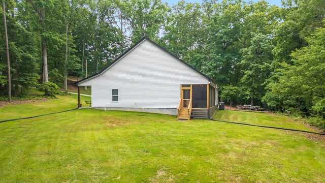 8331 Troubadour Way, Ooltewah, TN 37363 - view of property exterior featuring a sunroom and a lawn