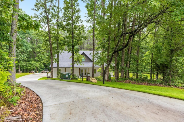 8331 Troubadour Way, Ooltewah, TN 37363 - view of front of property with concrete driveway, a front lawn, and french doors