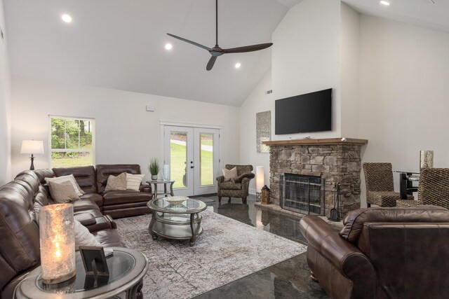 8331 Troubadour Way, Ooltewah, TN 37363 - living area with high vaulted ceiling, ceiling fan, a stone fireplace, recessed lighting, and french doors