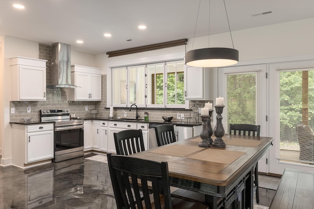 8331 Troubadour Way, Ooltewah, TN 37363 - kitchen featuring appliances with stainless steel finishes, wall chimney exhaust hood, dark countertops, a sink, and tasteful backsplash