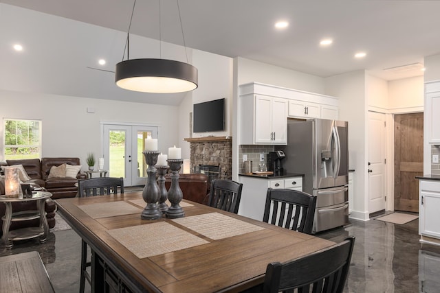 8331 Troubadour Way, Ooltewah, TN 37363 - dining room featuring recessed lighting, a stone fireplace, and french doors