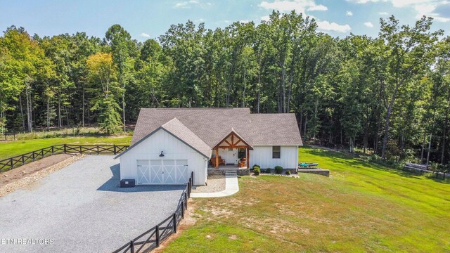 126 Homestead Hollow Rd, Lancing, TN 37770 - view of front facade with board and batten siding, a view of trees, and gravel driveway
