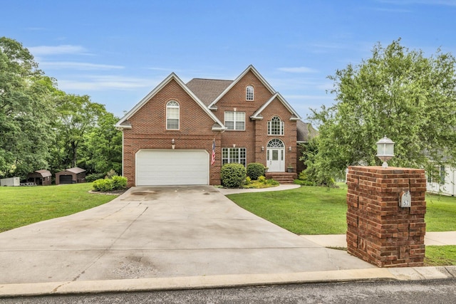57 Clear Springs Dr, Ringgold, GA 30736 - view of front facade featuring an attached garage, concrete driveway, brick siding, and a front yard
