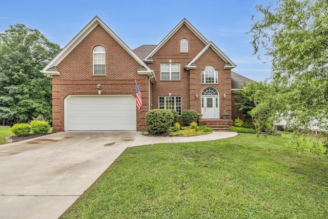 57 Clear Springs Dr, Ringgold, GA 30736 - view of front of house with a garage, brick siding, a front lawn, and driveway