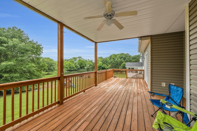 57 Clear Springs Dr, Ringgold, GA 30736 - wooden deck with ceiling fan, view of scattered trees, and a lawn