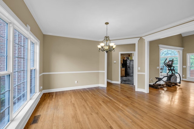 57 Clear Springs Dr, Ringgold, GA 30736 - unfurnished dining area featuring light wood-style flooring, a chandelier, baseboards, and ornamental molding