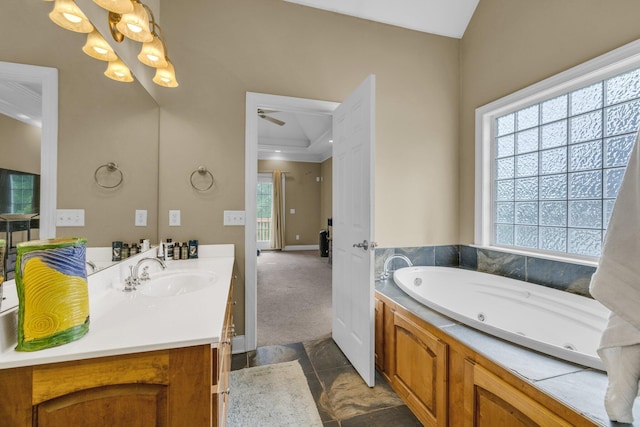 57 Clear Springs Dr, Ringgold, GA 30736 - bathroom with vanity, a jetted tub, ornamental molding, a ceiling fan, and baseboards