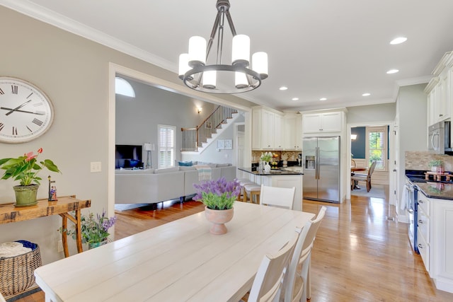 3429 Willow Lake Cir, Chattanooga, TN 37419 - dining space with a chandelier, light wood-style flooring, ornamental molding, and recessed lighting