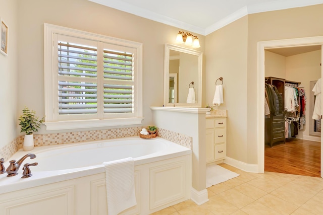 3429 Willow Lake Cir, Chattanooga, TN 37419 - bathroom with vanity, a bath, a walk in closet, tile patterned flooring, and crown molding