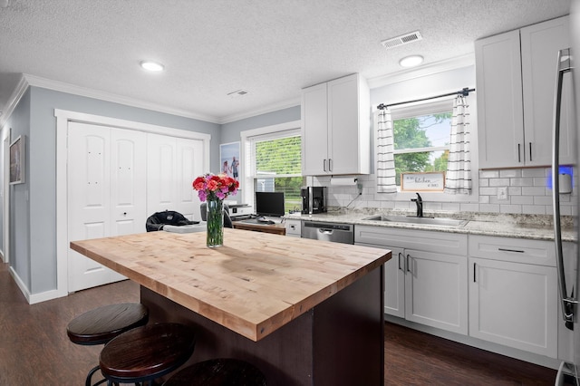 142 Jones Dr, Dunlap, TN 37327 - kitchen featuring wooden counters, a sink, ornamental molding, stainless steel dishwasher, and dark wood-style flooring