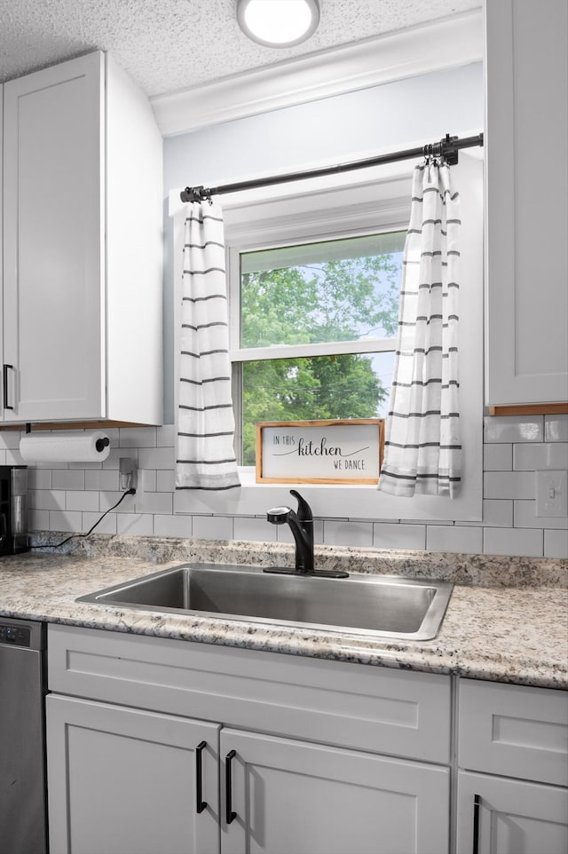 142 Jones Dr, Dunlap, TN 37327 - kitchen with a sink, tasteful backsplash, dishwasher, and a textured ceiling