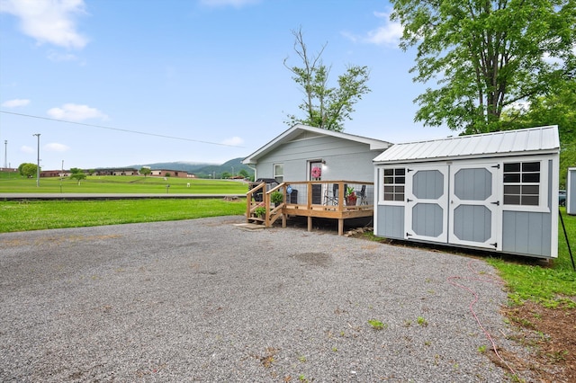142 Jones Dr, Dunlap, TN 37327 - view of front of house with a deck, a front lawn, and metal roof