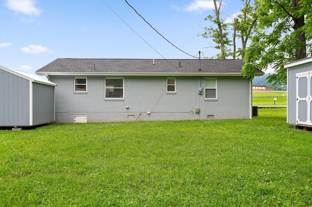 142 Jones Dr, Dunlap, TN 37327 - rear view of house with crawl space, brick siding, a yard, and roof with shingles