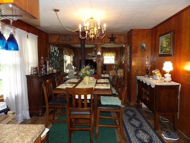 634 Bellvue Cir, Spencer, TN 38585 - dining area with wooden walls, a chandelier, and wood finished floors