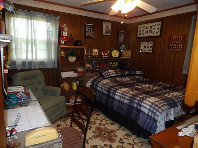 634 Bellvue Cir, Spencer, TN 38585 - bedroom featuring wooden walls and a ceiling fan