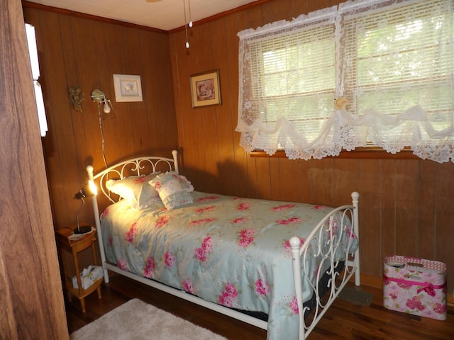 634 Bellvue Cir, Spencer, TN 38585 - bedroom featuring wood finished floors and wooden walls