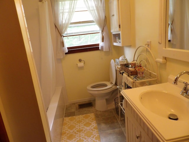 634 Bellvue Cir, Spencer, TN 38585 - bathroom featuring toilet, vanity, tile patterned flooring, and baseboards