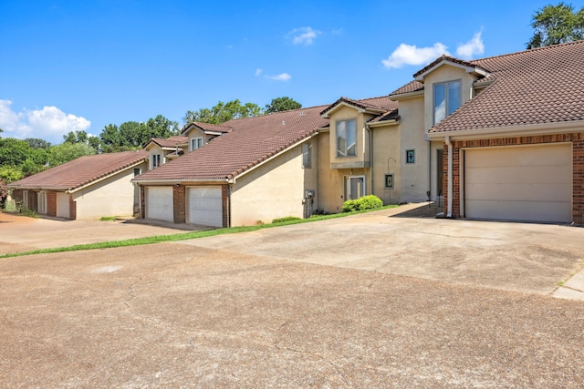 2138 Vaden Village Dr, Chattanooga, TN 37421 - view of front of house with stucco siding and a tile roof