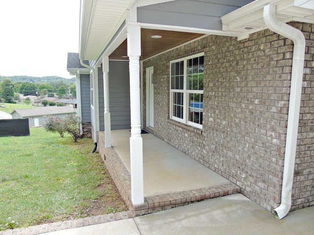 135 Joseph Daniel Ln, Jasper, TN 37347 - view of home's exterior featuring brick siding, covered porch, and a yard