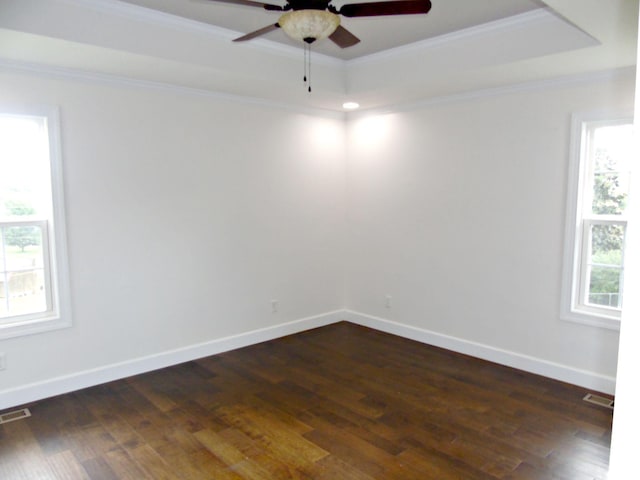 135 Joseph Daniel Ln, Jasper, TN 37347 - empty room with a raised ceiling, a ceiling fan, crown molding, and dark wood-style flooring