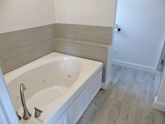 135 Joseph Daniel Ln, Jasper, TN 37347 - full bath with a tub with jets and wood finished floors
