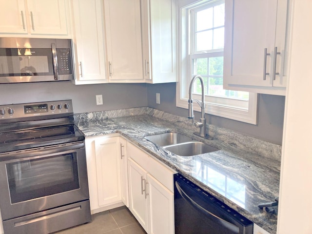 135 Joseph Daniel Ln, Jasper, TN 37347 - kitchen featuring stainless steel appliances, white cabinets, tile patterned floors, and light stone countertops