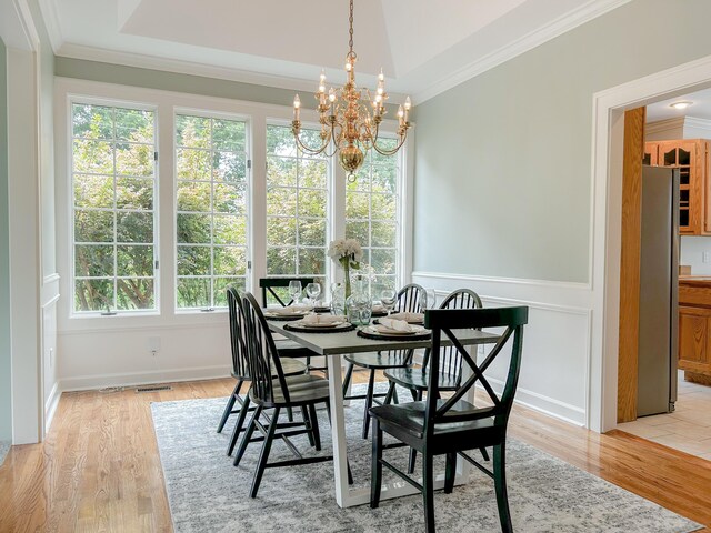 4155 Freewill Rd NW, Cleveland, TN 37312 - dining space featuring a chandelier, crown molding, and light wood finished floors