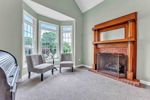 4155 Freewill Rd NW, Cleveland, TN 37312 - living area featuring a brick fireplace, carpet, vaulted ceiling, and baseboards