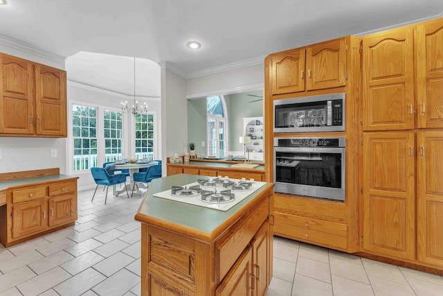 4155 Freewill Rd NW, Cleveland, TN 37312 - kitchen featuring stainless steel appliances, ornamental molding, a chandelier, a center island, and light tile patterned floors
