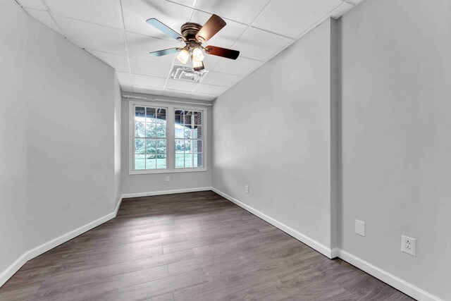 4155 Freewill Rd NW, Cleveland, TN 37312 - unfurnished room with a ceiling fan, a paneled ceiling, wood finished floors, and baseboards