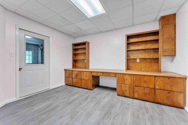 4155 Freewill Rd NW, Cleveland, TN 37312 - unfurnished office featuring light wood-type flooring, a paneled ceiling, built in desk, and baseboards