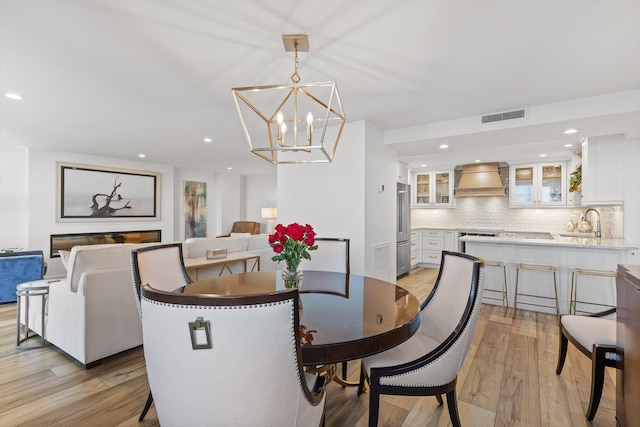 1131 Stringers Ridge Rd Unit 12E, Chattanooga, TN 37405 - dining area with light wood-type flooring, a chandelier, and recessed lighting