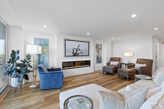 1131 Stringers Ridge Rd Unit 12E, Chattanooga, TN 37405 - living room with wood finished floors, a glass covered fireplace, recessed lighting, and baseboards