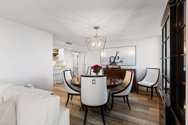 1131 Stringers Ridge Rd Unit 12E, Chattanooga, TN 37405 - dining space with a chandelier and light wood-style flooring