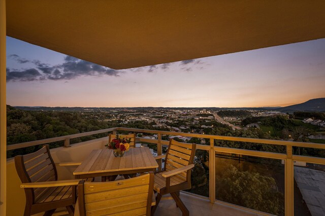 1131 Stringers Ridge Rd Unit 12E, Chattanooga, TN 37405 - balcony at dusk featuring outdoor dining space
