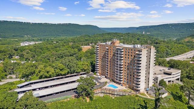 1131 Stringers Ridge Rd Unit 12E, Chattanooga, TN 37405 - aerial view of a forest, a pool, and a mountainous background