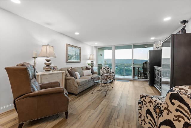 1131 Stringers Ridge Rd Unit 12B, Chattanooga, TN 37405 - living area with light wood finished floors, floor to ceiling windows, and recessed lighting