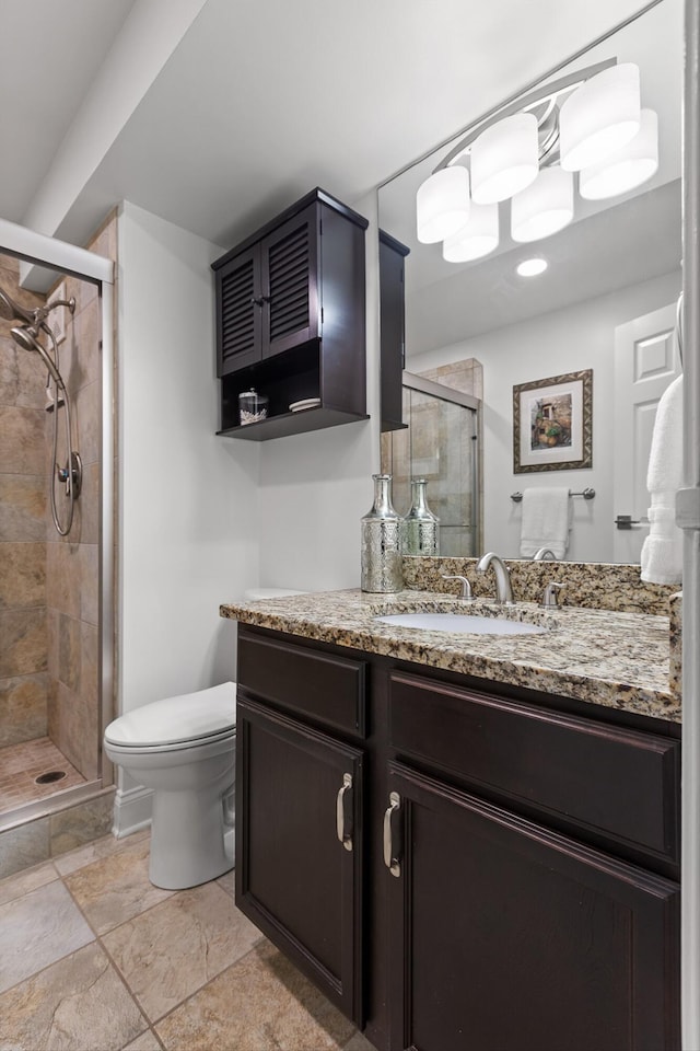 1131 Stringers Ridge Rd Unit 12B, Chattanooga, TN 37405 - bathroom featuring toilet, a stall shower, vanity, and stone finish floors