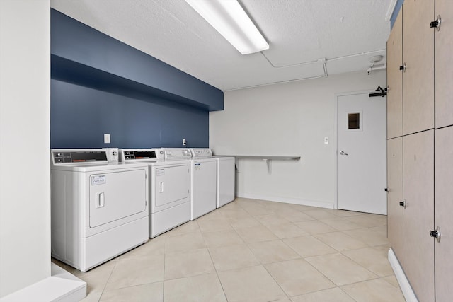 1131 Stringers Ridge Rd Unit 12B, Chattanooga, TN 37405 - shared laundry room with independent washer and dryer, a textured ceiling, and light tile patterned floors