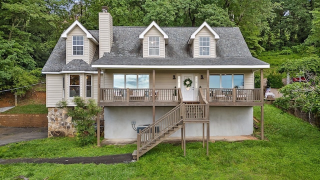 1714 S Crest Manor Ln, Chattanooga, TN 37404 - cape cod-style house with stairs, a front lawn, a chimney, and roof with shingles