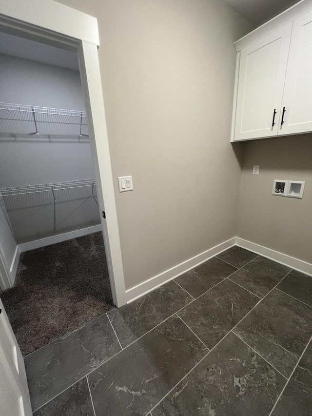 549 Willow Grv Ct Unit 69, Ringgold, GA 30736 - laundry area with cabinet space, baseboards, washer hookup, and dark marble finish floors