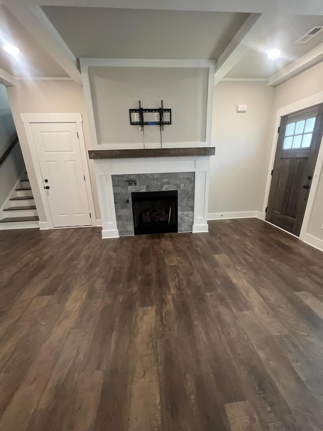 549 Willow Grv Ct Unit 69, Ringgold, GA 30736 - unfurnished living room featuring dark wood finished floors, a tiled fireplace, stairway, baseboards, and beam ceiling