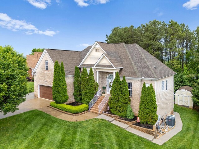 4322 Wellesley Dr, Ooltewah, TN 37363 - view of front of property featuring cooling unit, a front lawn, an attached garage, and concrete driveway