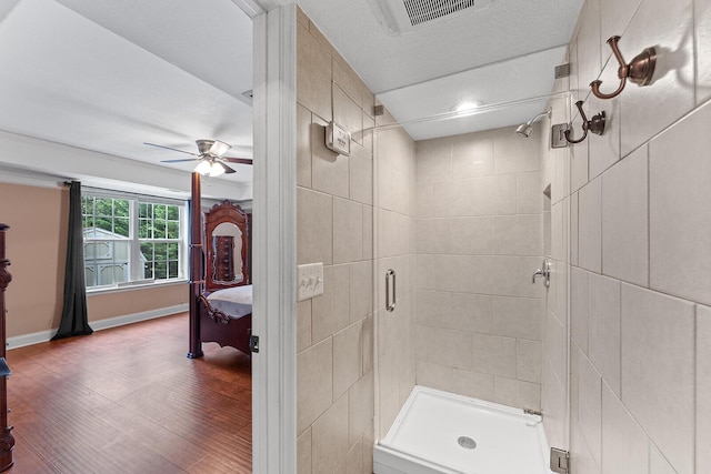 4322 Wellesley Dr, Ooltewah, TN 37363 - ensuite bathroom with a stall shower, a ceiling fan, wood finished floors, and baseboards