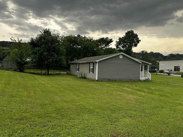 219 Igou Ferry Rd, Soddy Daisy, TN 37379 - view of grassy yard featuring central AC and view of scattered trees