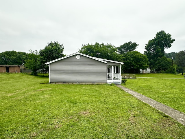219 Igou Ferry Rd, Soddy Daisy, TN 37379 - view of home's exterior featuring crawl space, a yard, covered porch, and view of scattered trees