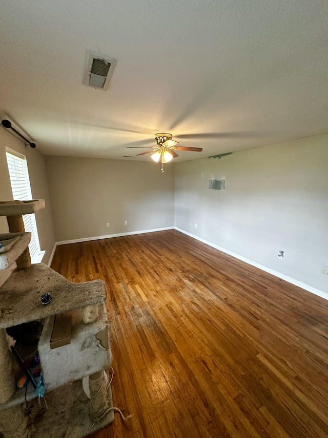 219 Igou Ferry Rd, Soddy Daisy, TN 37379 - spare room with wood finished floors, ceiling fan, and baseboards